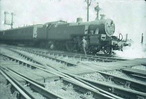 An LMS 2-6-4T carries out a shunting manouvre at the south end of station avoiding line. The LNWR signals lasted until the late 1970s.